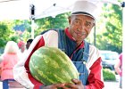 SpartMag-FarmersMarket-1 copy  George Garrett sells peaches, watermelons, and other produce at the farmers market at the train depot in Spartanburg Saturday morning, 7-1-06.   (NOTE: for SPARTANBURG MAGAZINE)